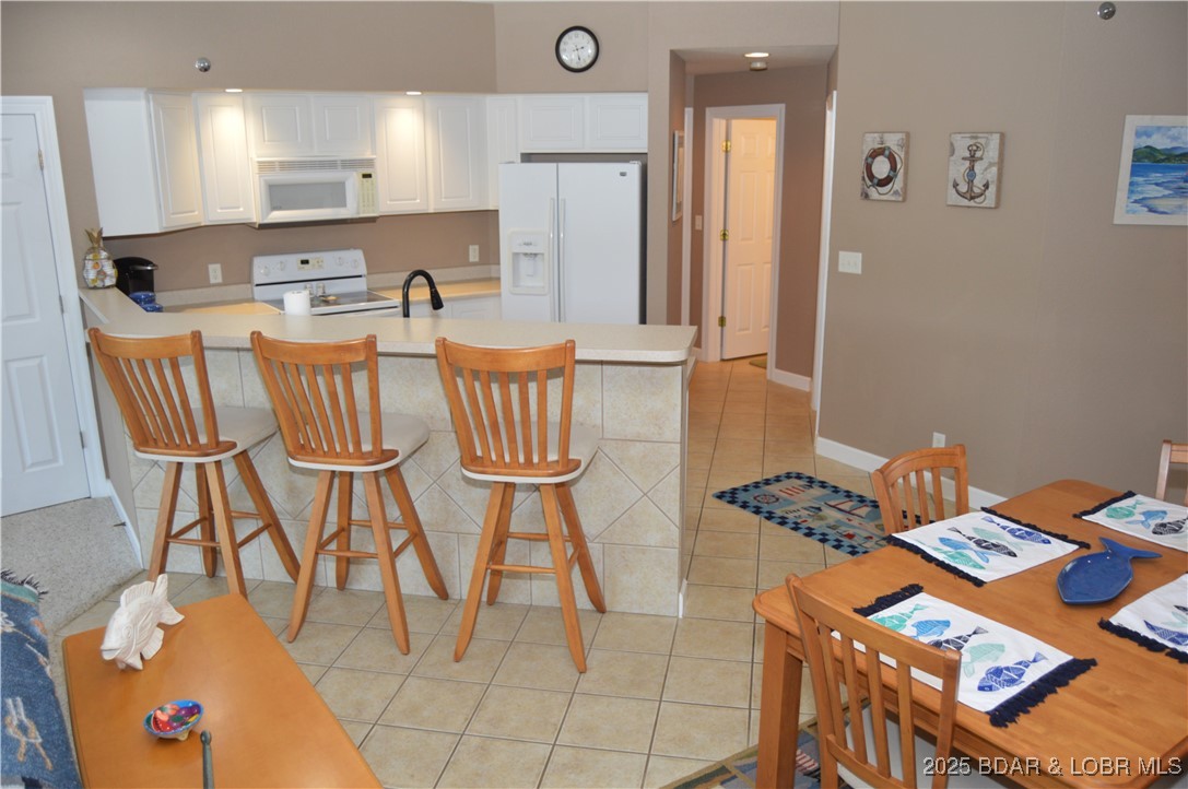 68 Lighthouse Road, Unit 133 Lake Ozark, MO 65049 - Photo 16 of 38 Lots of space to sit a the bar