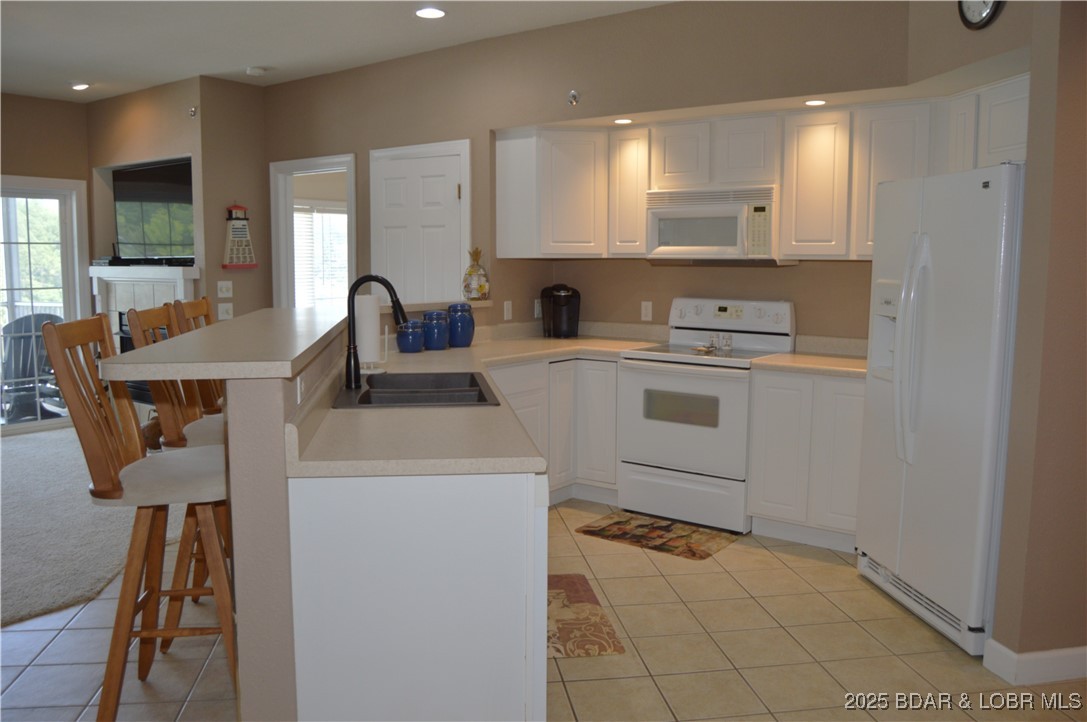 68 Lighthouse Road, Unit 133 Lake Ozark, MO 65049 - Photo 2 of 38 Light and bright kitchen with lots of storage