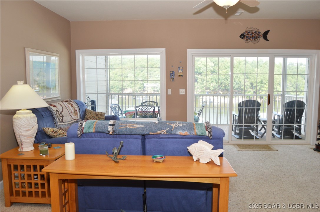 68 Lighthouse Road, Unit 133 Lake Ozark, MO 65049 - Photo 3 of 38 Living Room with wall of windows providing natural