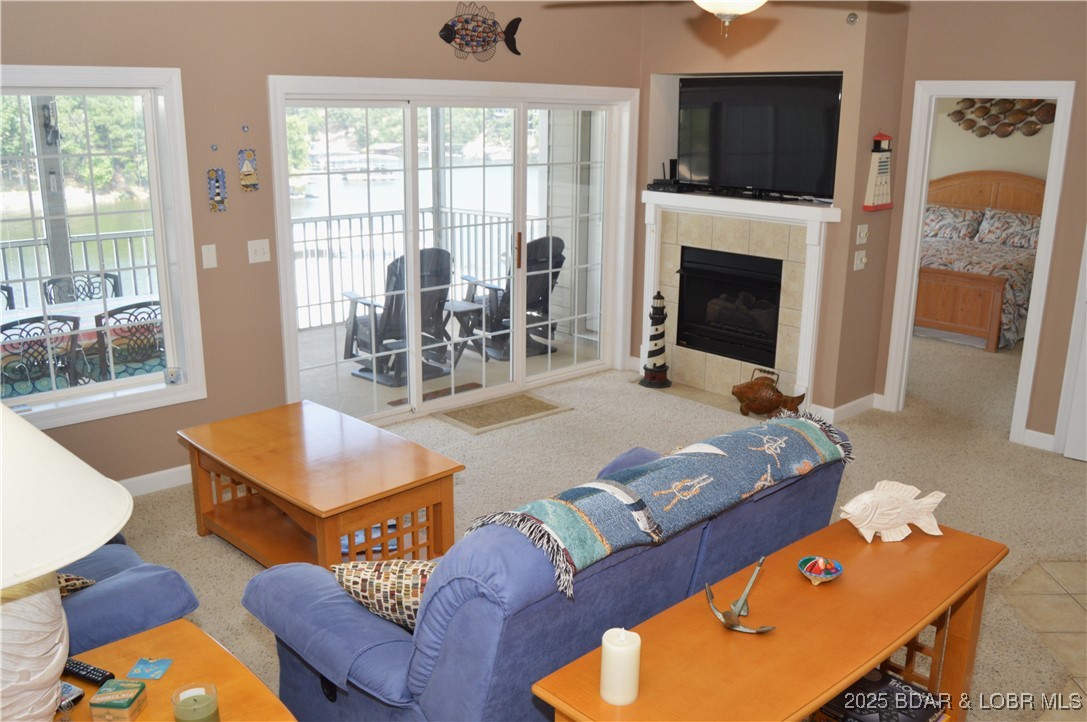 68 Lighthouse Road, Unit 133 Lake Ozark, MO 65049 - Photo 5 of 38 Living room with easy access to screened deck