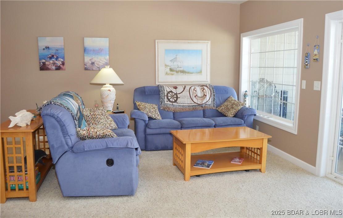 68 Lighthouse Road, Unit 133 Lake Ozark, MO 65049 - Photo 7 of 38 Living Room with reclining sofa and loveseat