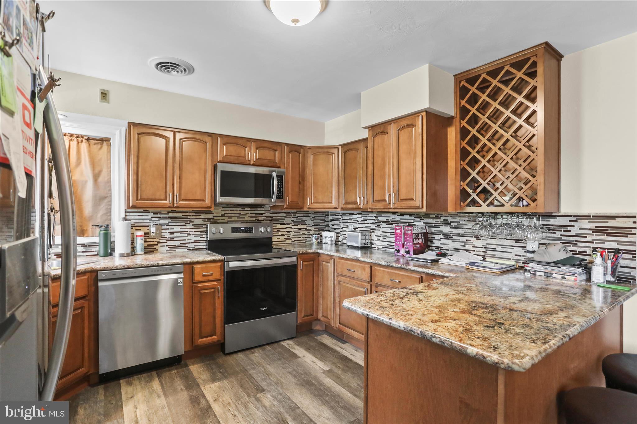88 Sunset Drive Hanover, PA 17331 - Photo 8 of 51 a kitchen with stainless steel appliances granite countertop a sink stove and microwave