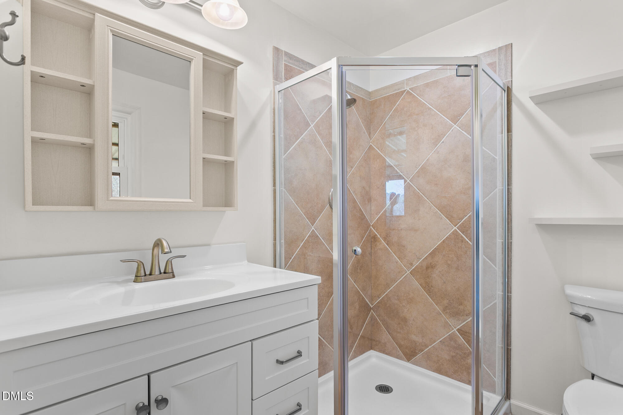 2221 Gerringer Mill Road Elon, NC 27244 - Photo 20 of 39 a bathroom with a shower a sink and a mirror
