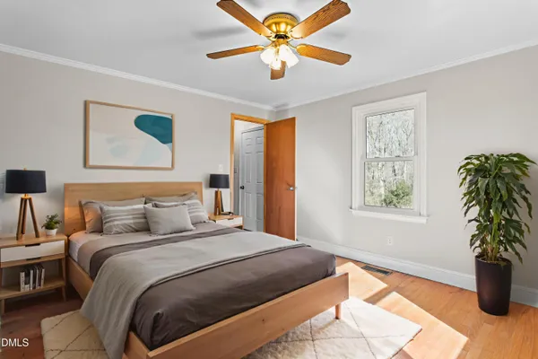 a bedroom with a large bed and a window