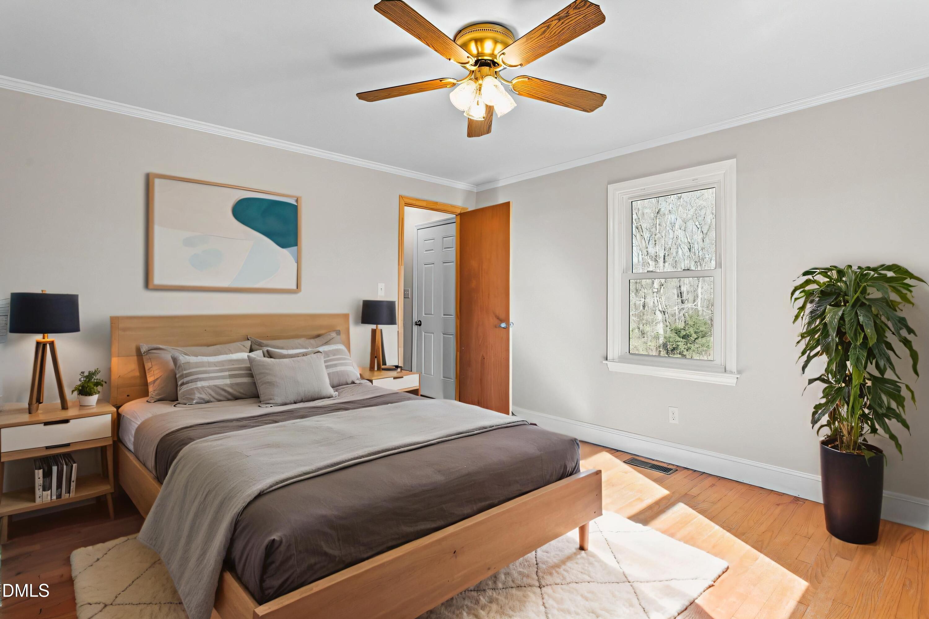 2221 Gerringer Mill Road Elon, NC 27244 - Photo 23 of 39 a bedroom with a bed and a window