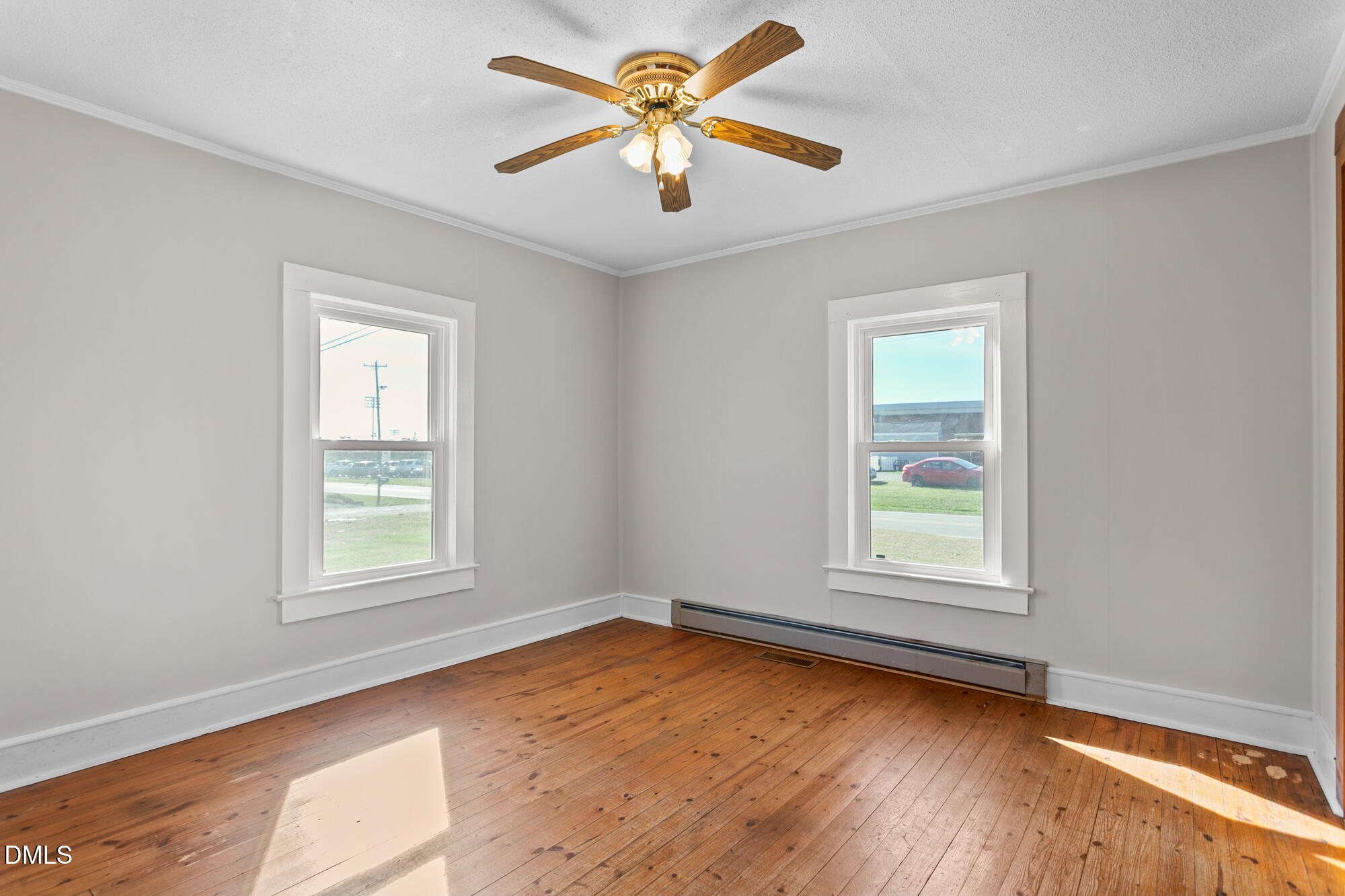 2221 Gerringer Mill Road Elon, NC 27244 - Photo 26 of 39 an empty room with window and a ceiling fan