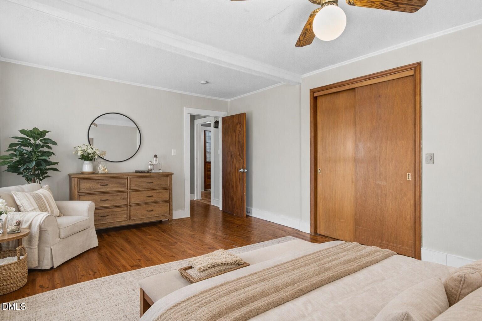 2221 Gerringer Mill Road Elon, NC 27244 - Photo 32 of 39 a bedroom with a bed and wooden floor