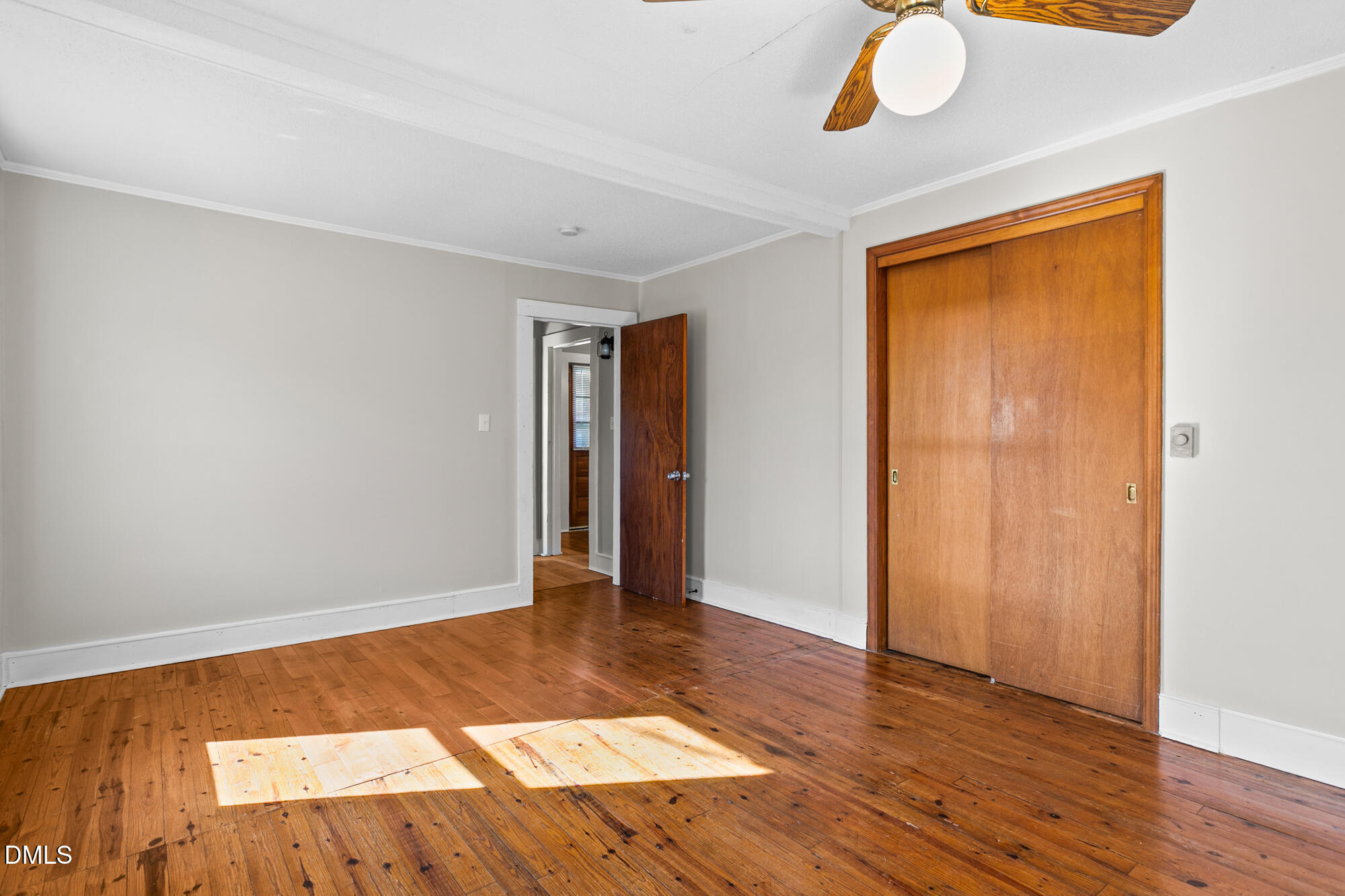 2221 Gerringer Mill Road Elon, NC 27244 - Photo 33 of 39 a view of an empty room and wooden floor