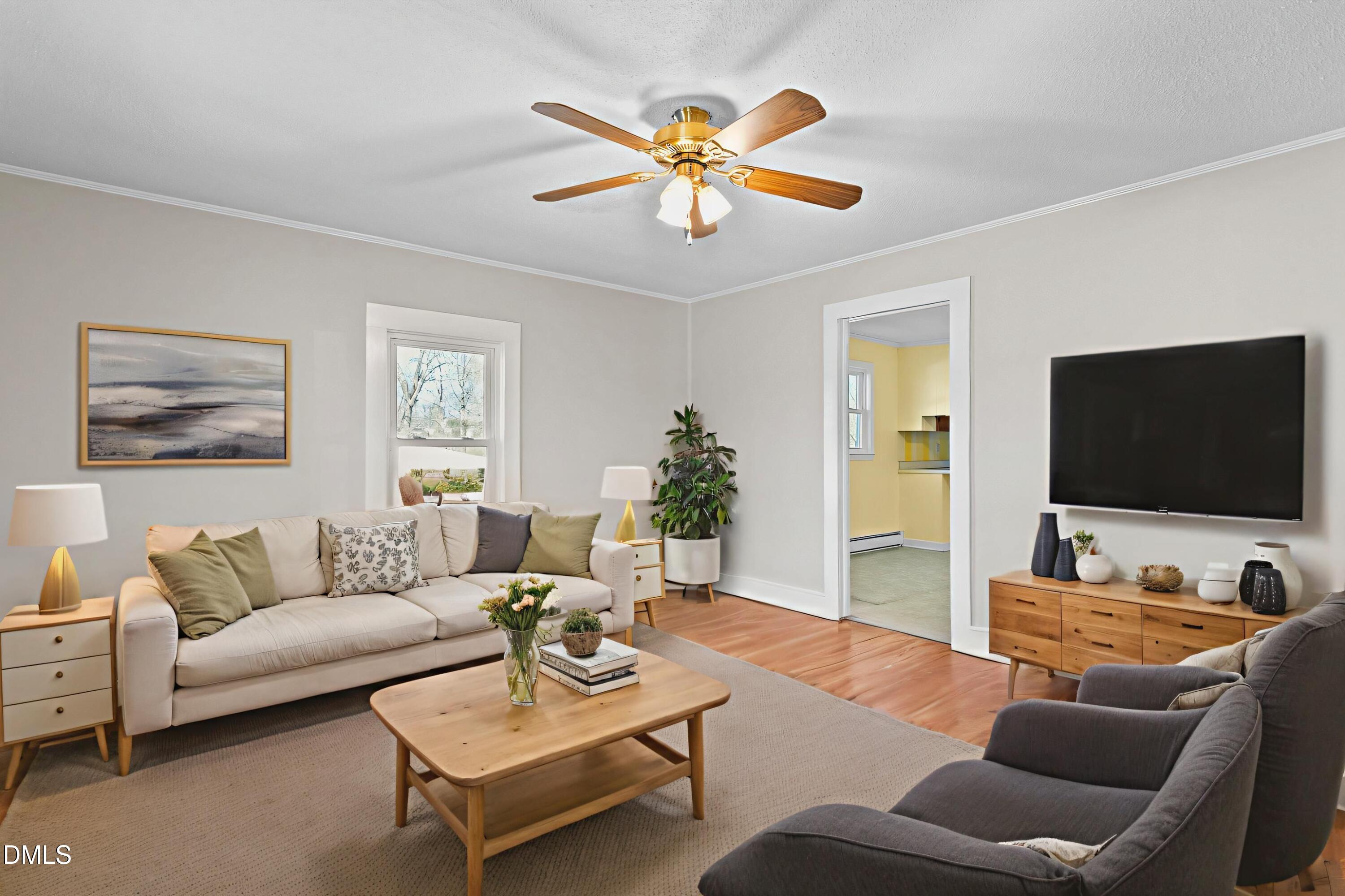 2221 Gerringer Mill Road Elon, NC 27244 - Photo 8 of 39 a living room with furniture and a flat screen tv