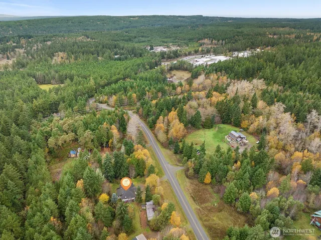 a view of a green field with an outdoor space