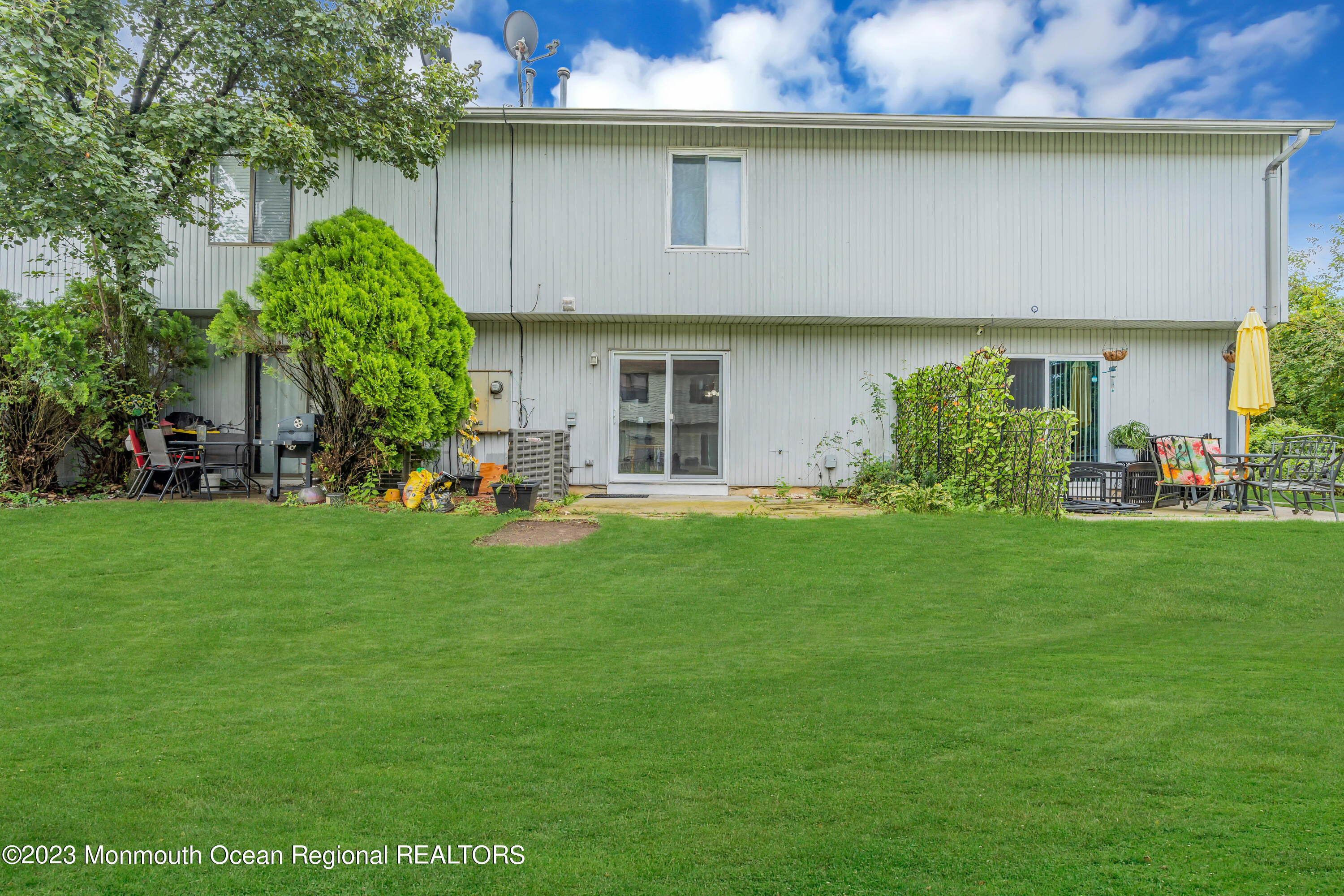 1110 Sawmill Road, Unit 103 Brick, NJ 08724 - Photo 13 of 13 a front view of house with a garden