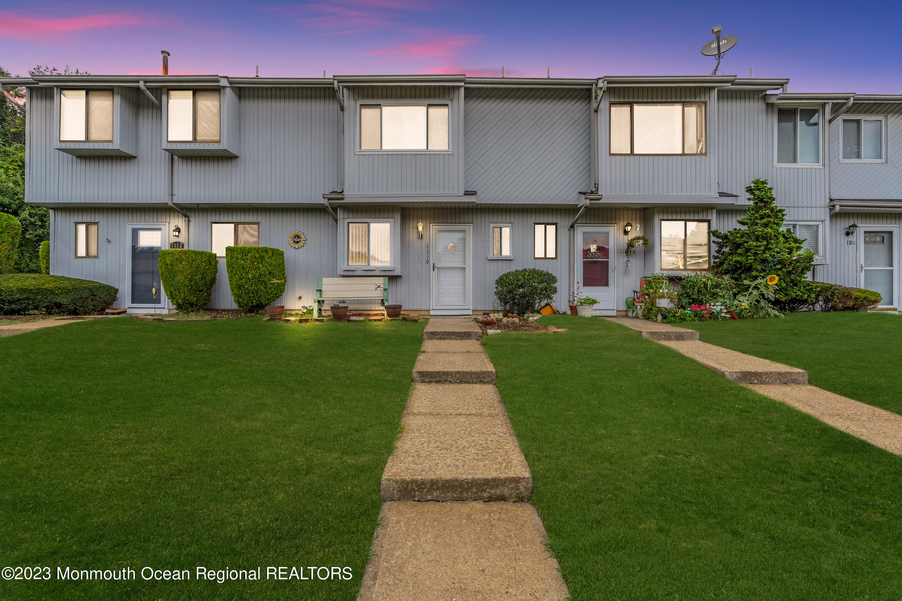 1110 Sawmill Road, Unit 103 Brick, NJ 08724 - Photo 2 of 13 a front view of a building with a garden