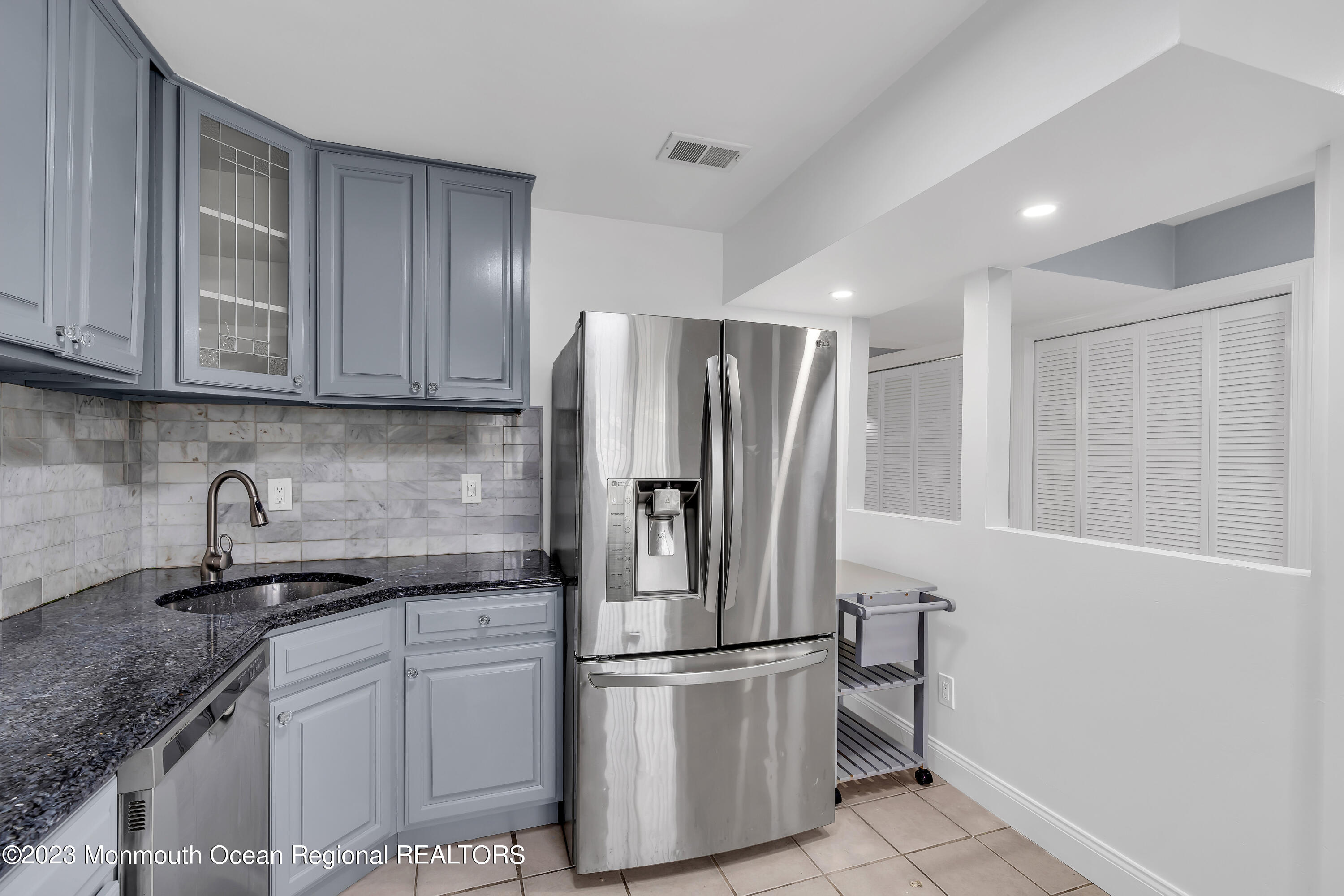 1110 Sawmill Road, Unit 103 Brick, NJ 08724 - Photo 3 of 13 a kitchen with stainless steel appliances granite countertop a refrigerator sink and cabinets