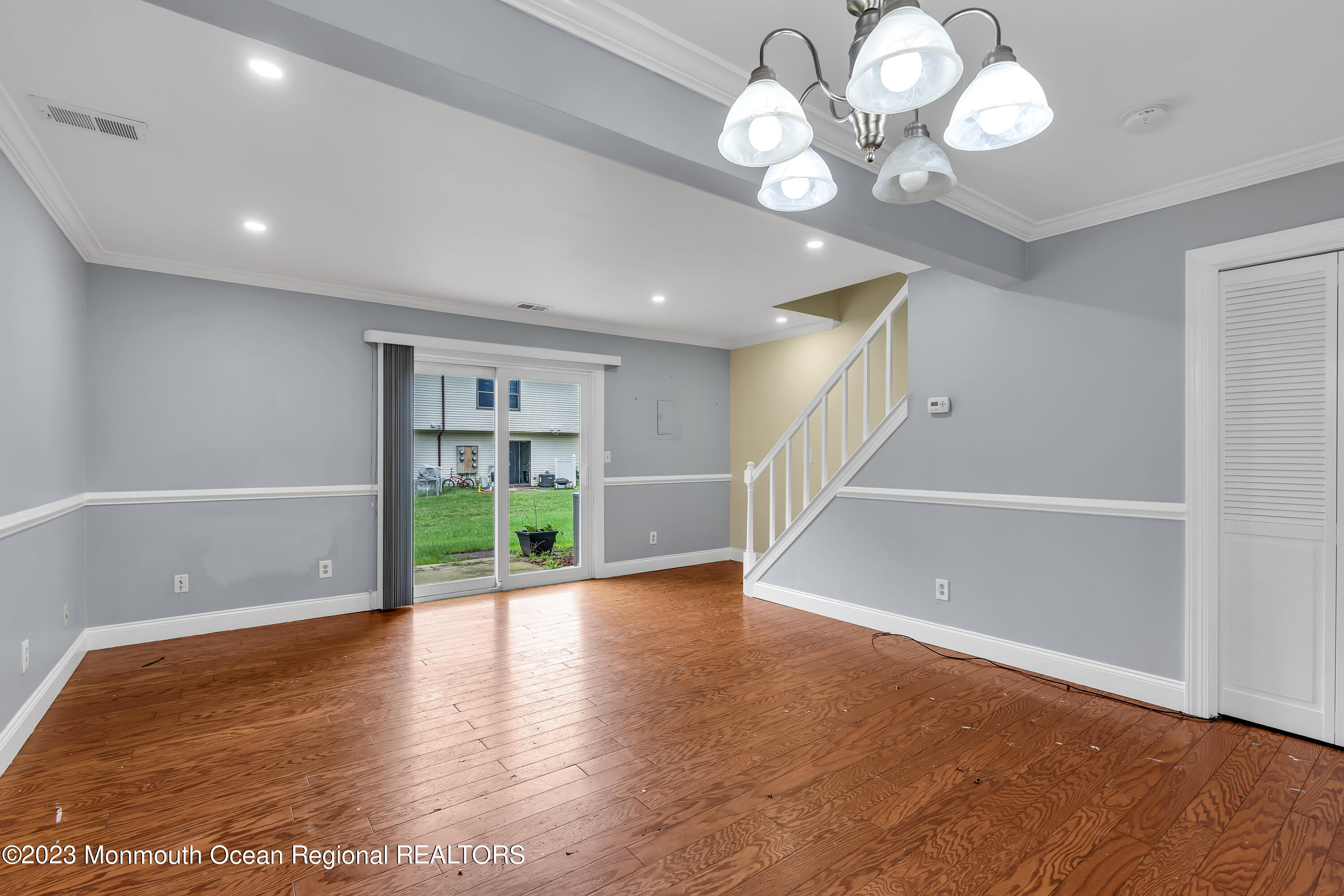 1110 Sawmill Road, Unit 103 Brick, NJ 08724 - Photo 4 of 13 a view of an empty room with wooden floor and a window