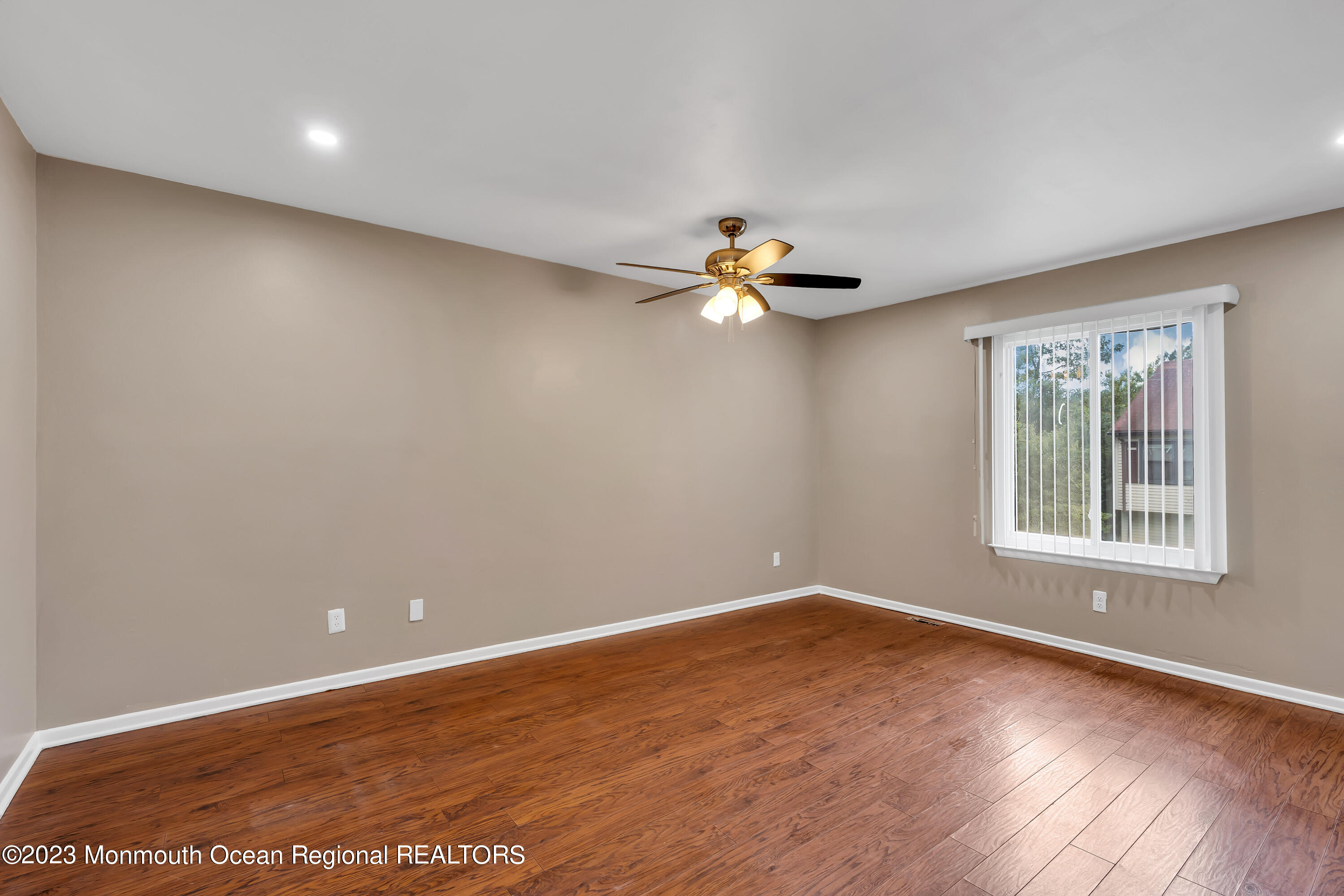 1110 Sawmill Road, Unit 103 Brick, NJ 08724 - Photo 9 of 13 wooden floor in an empty room with a window