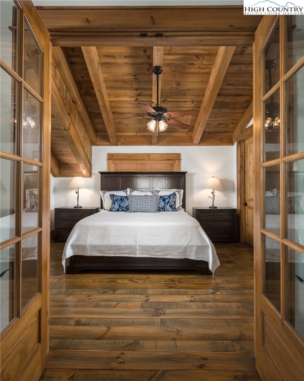 708 Goldenrod Road Boone, NC 28607 - Photo 25 of 49 a bedroom with a bed and wooden floor