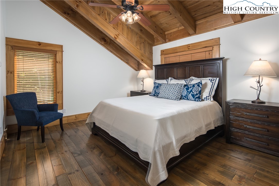 708 Goldenrod Road Boone, NC 28607 - Photo 26 of 49 a bedroom with bed and a chair