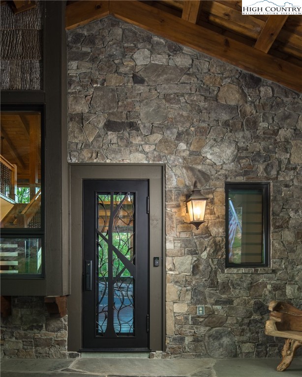 708 Goldenrod Road Boone, NC 28607 - Photo 3 of 49 a stone house with a outdoor space