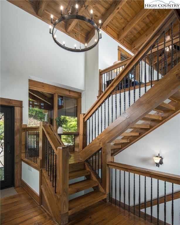 708 Goldenrod Road Boone, NC 28607 - Photo 4 of 49 a view of staircase with railing and a chandelier