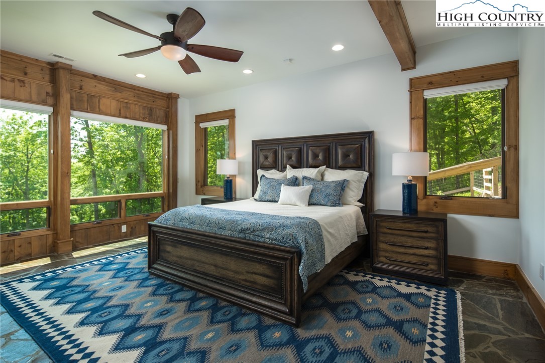 708 Goldenrod Road Boone, NC 28607 - Photo 42 of 49 a bed sitting in a spacious bedroom next to a window