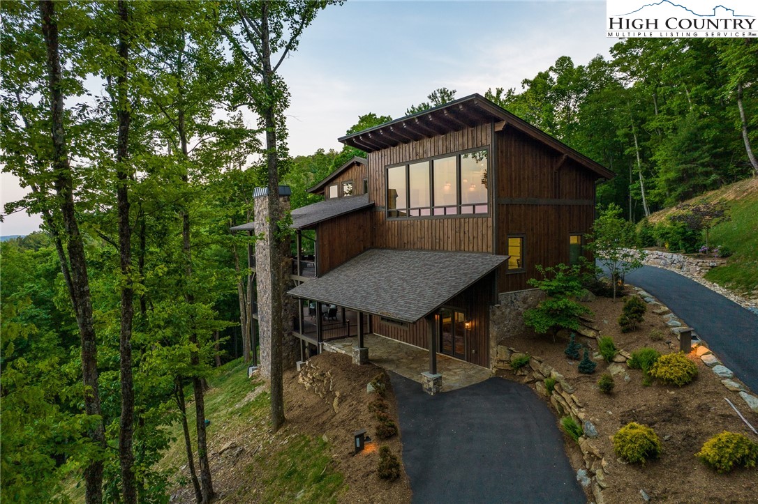 708 Goldenrod Road Boone, NC 28607 - Photo 46 of 49 a backyard of a house with table and chairs