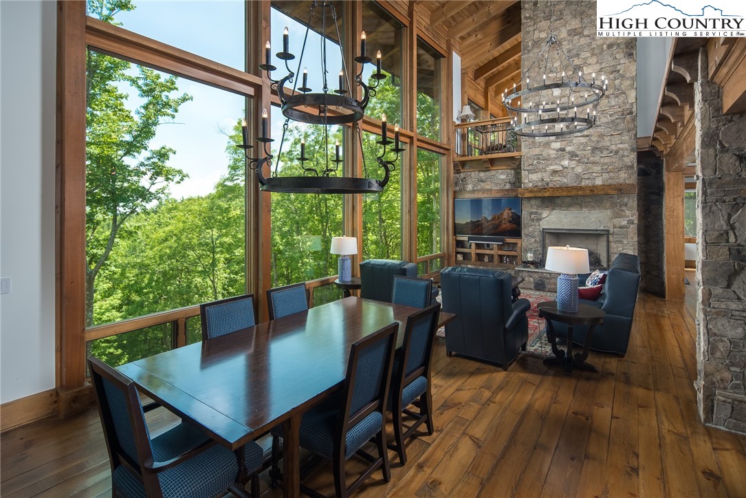 708 Goldenrod Road Boone, NC 28607 - Photo 7 of 49 a view of a dining room with furniture window and wooden floor