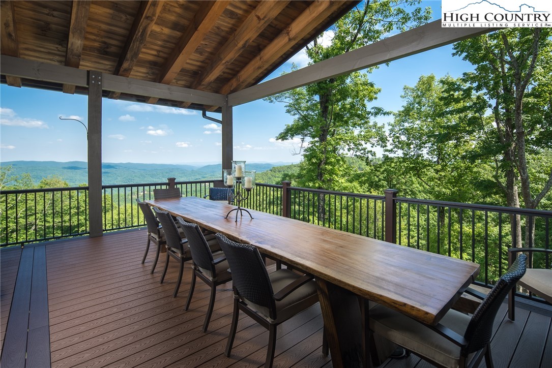 708 Goldenrod Road Boone, NC 28607 - Photo 10 of 49 a view of a balcony with a table and chairs