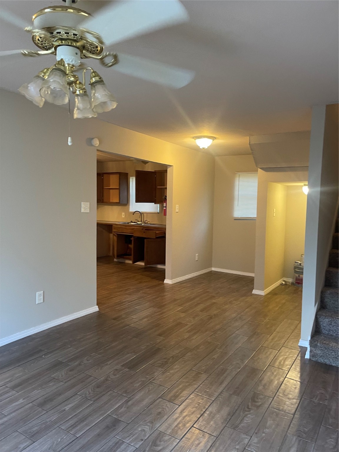 a view of livingroom with kitchen island furniture and wooden floor
