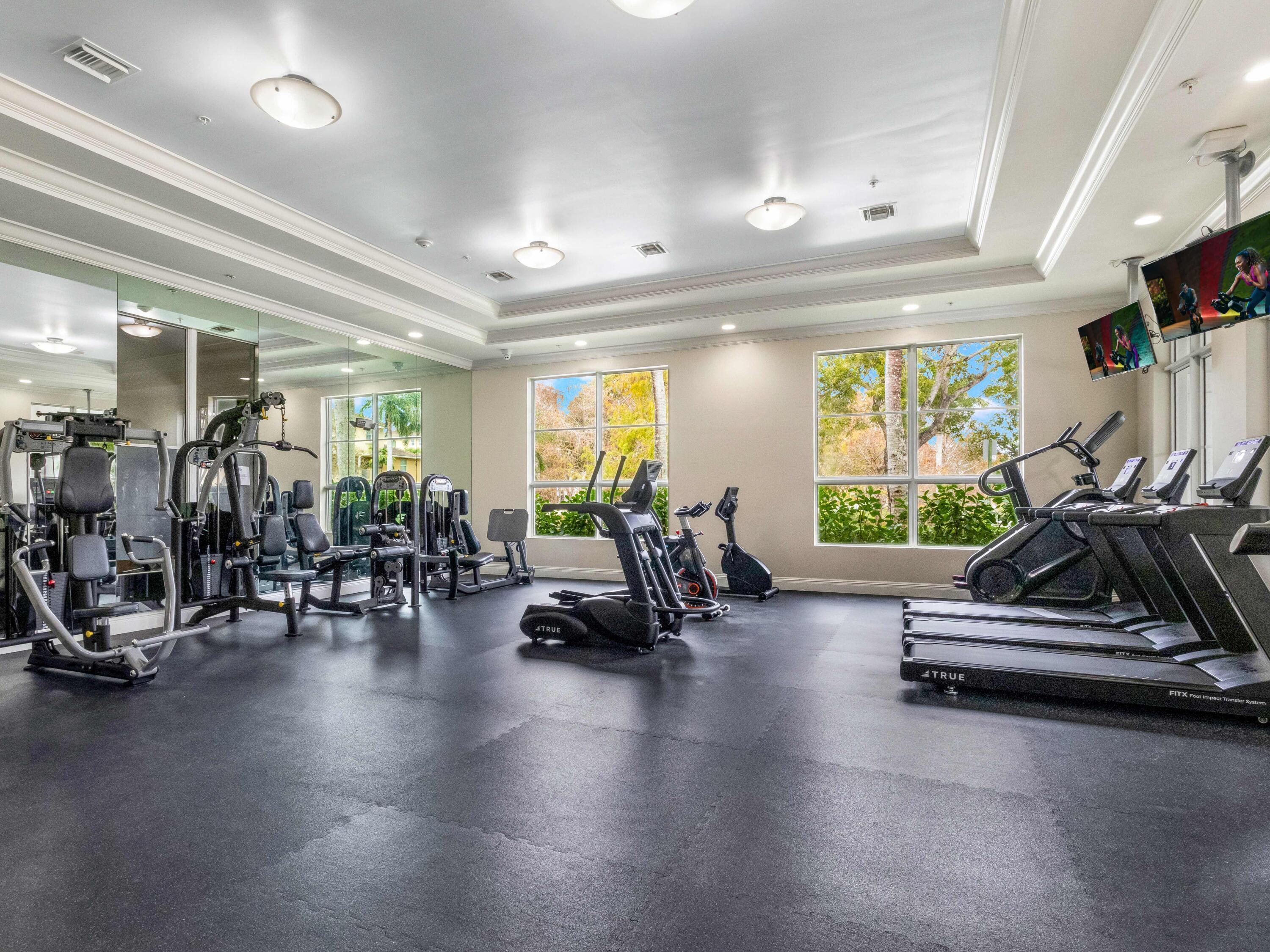 1690 Renaissance Commons Boulevard, Unit 1412 Boynton Beach, FL 33426 - Photo 37 of 49 a view of a room with gym equipment