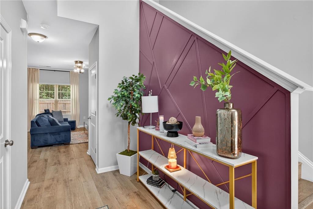 3333 Cascade Parc Boulevard Southwest Atlanta, GA 30311 - Photo 2 of 21 a living room with furniture and a potted plant