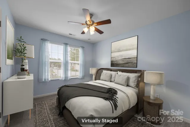 a bed room with a bed and a window