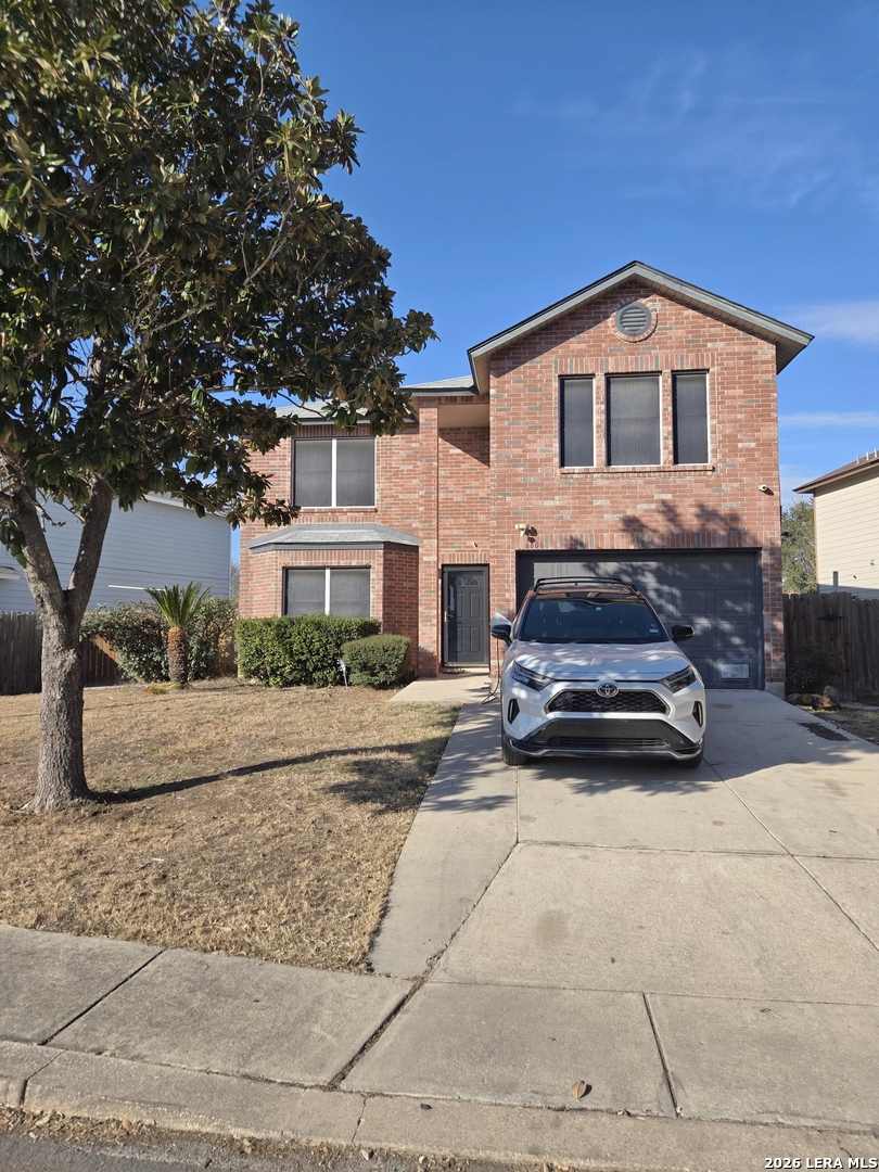 a view of a car parked in front of house