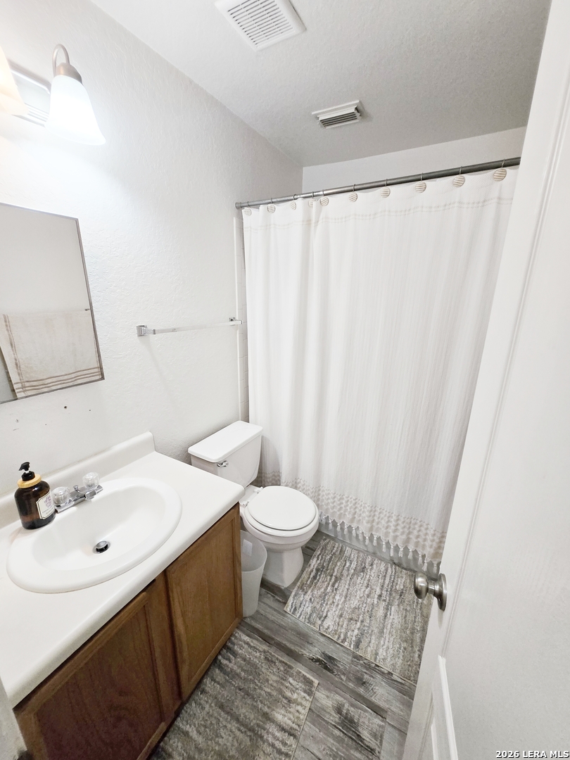 6606 Highland Grass Converse, TX 78109 - Photo 17 of 27 a bathroom with a sink and a mirror