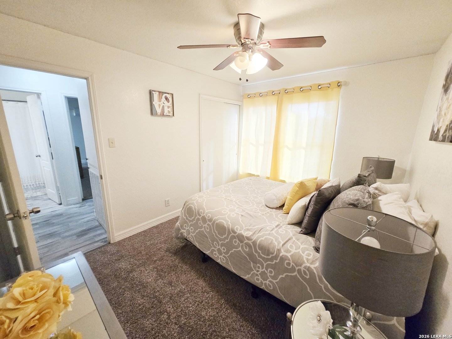 6606 Highland Grass Converse, TX 78109 - Photo 19 of 27 a bed sitting in a bedroom next to a window