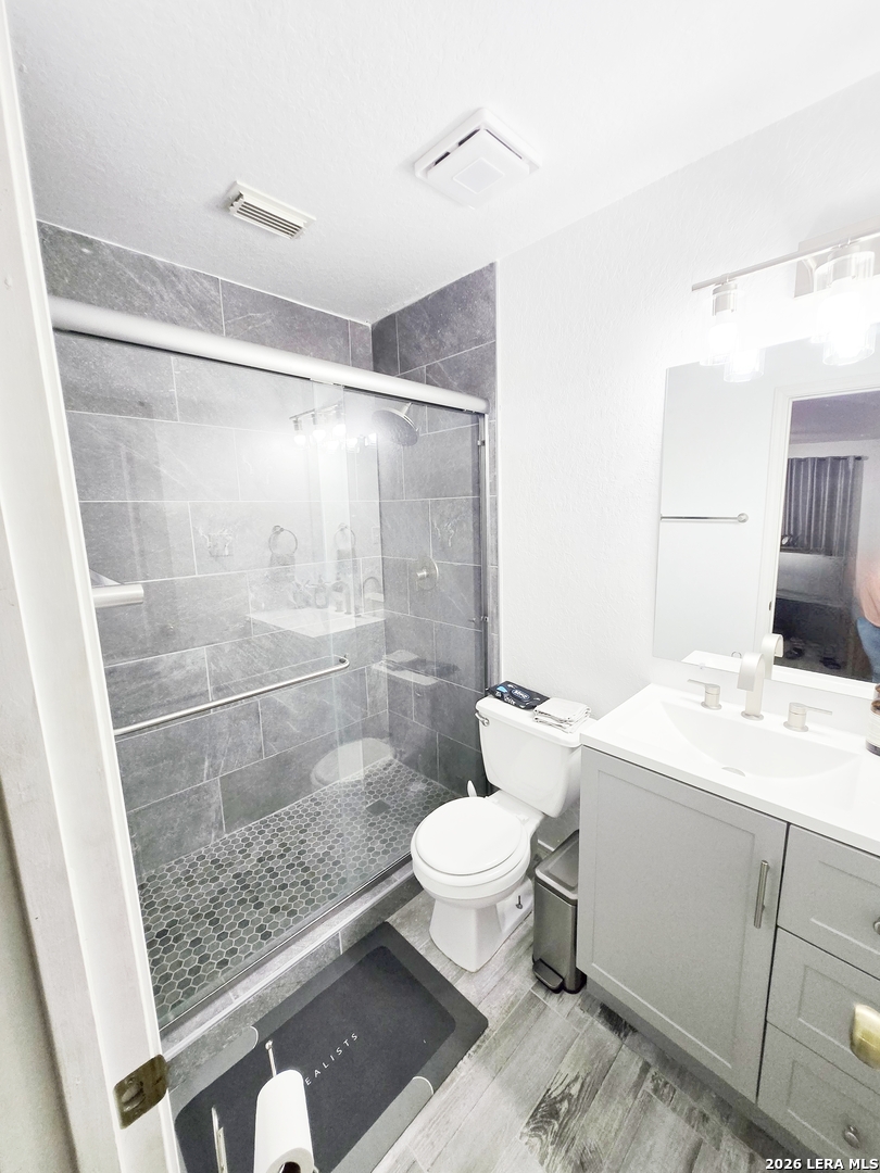 6606 Highland Grass Converse, TX 78109 - Photo 23 of 27 a bathroom with a sink toilet and shower