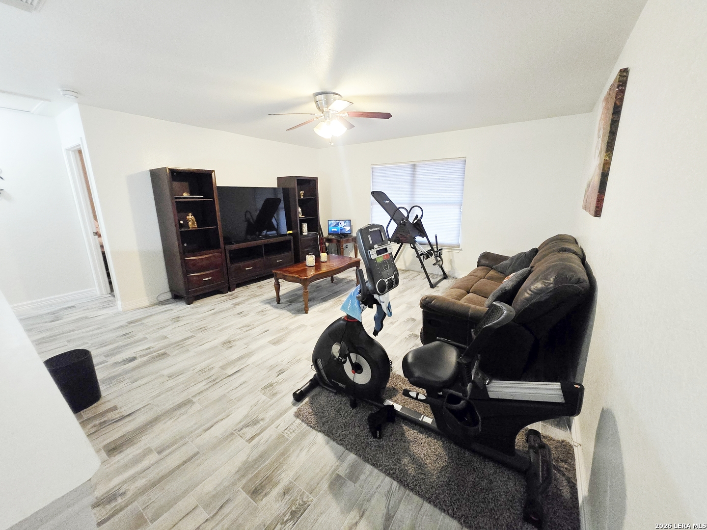 6606 Highland Grass Converse, TX 78109 - Photo 24 of 27 a living room with furniture and a flat screen tv