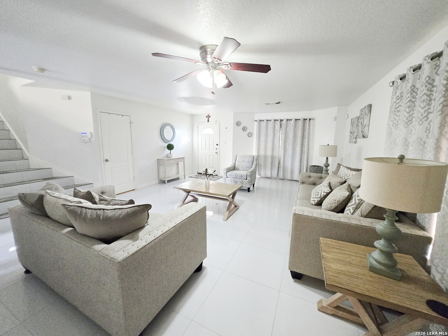 6606 Highland Grass Converse, TX 78109 - Photo 3 of 27 a living room with furniture and a chandelier