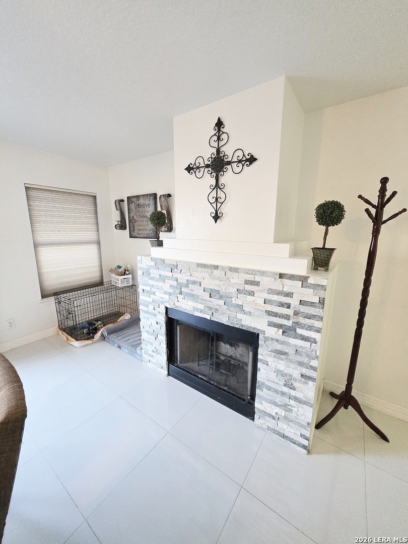 6606 Highland Grass Converse, TX 78109 - Photo 5 of 27 a living room with furniture and a fireplace