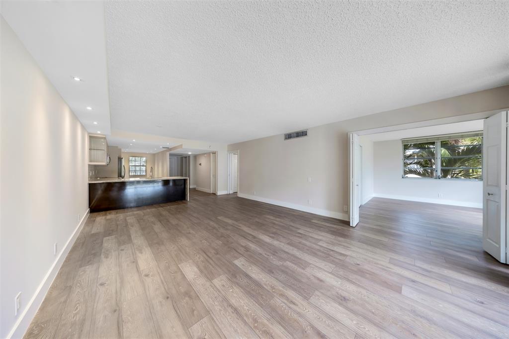 800 East Cypress Lane, Unit 206 Pompano Beach, FL 33069 - Photo 12 of 33 a view of empty room with wooden floor