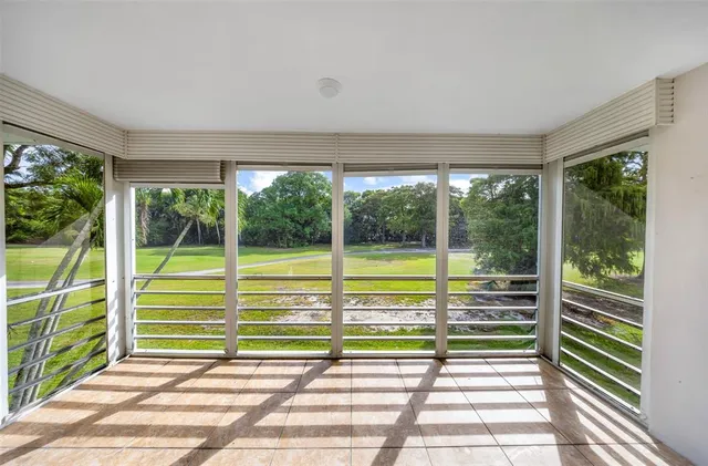 a view of a porch and garden
