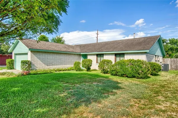 a view of a house with a garden