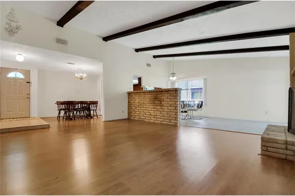 a view of kitchen with furniture and wooden floor
