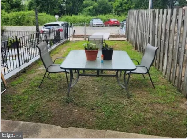 a view of a patio with a table chairs and a table