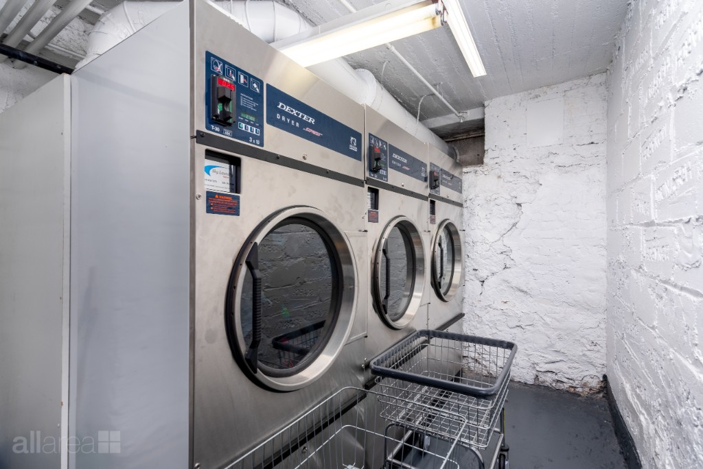 39-75 56th Street, Unit 2A Queens, NY 11377 - Photo 10 of 12 a utility room with dryer and washer
