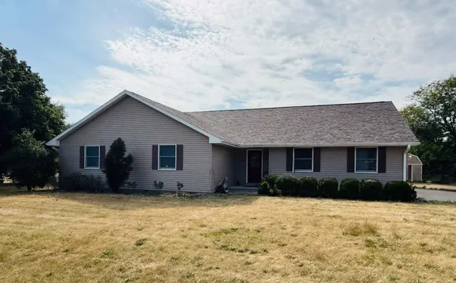 a house with trees in the background