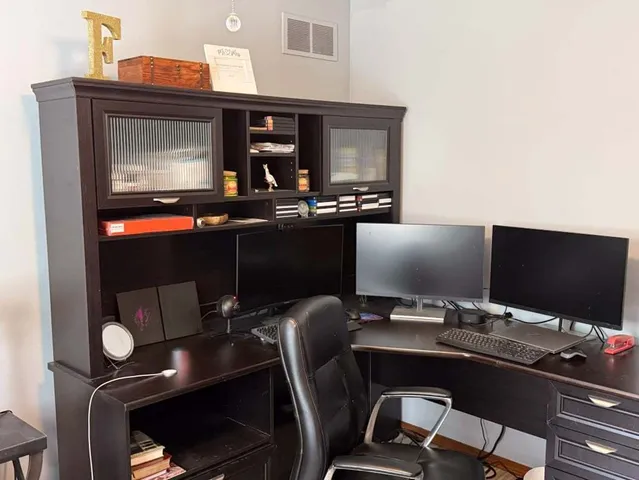 a room with a chair and tables