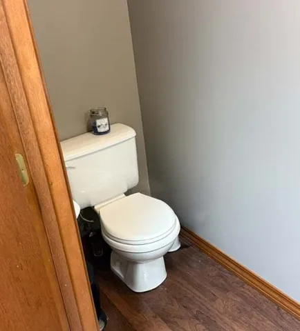 a white toilet sitting next to a sink