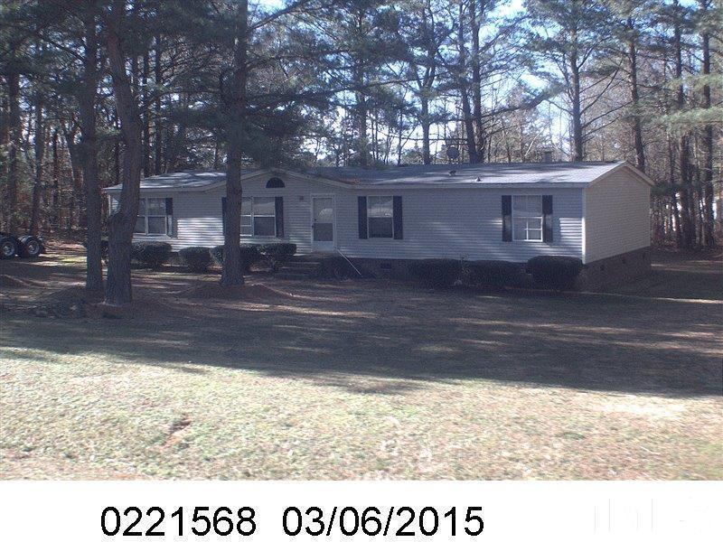 1113 Yakimas Road Raleigh, NC 27603 - Photo 1 of 3 a black and white photo of a house