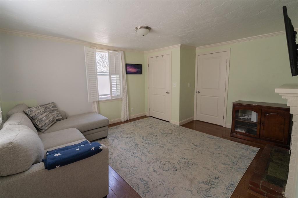 35 Neponset Street Canton, MA 02021 - Photo 12 of 29 a living room with furniture and a fireplace