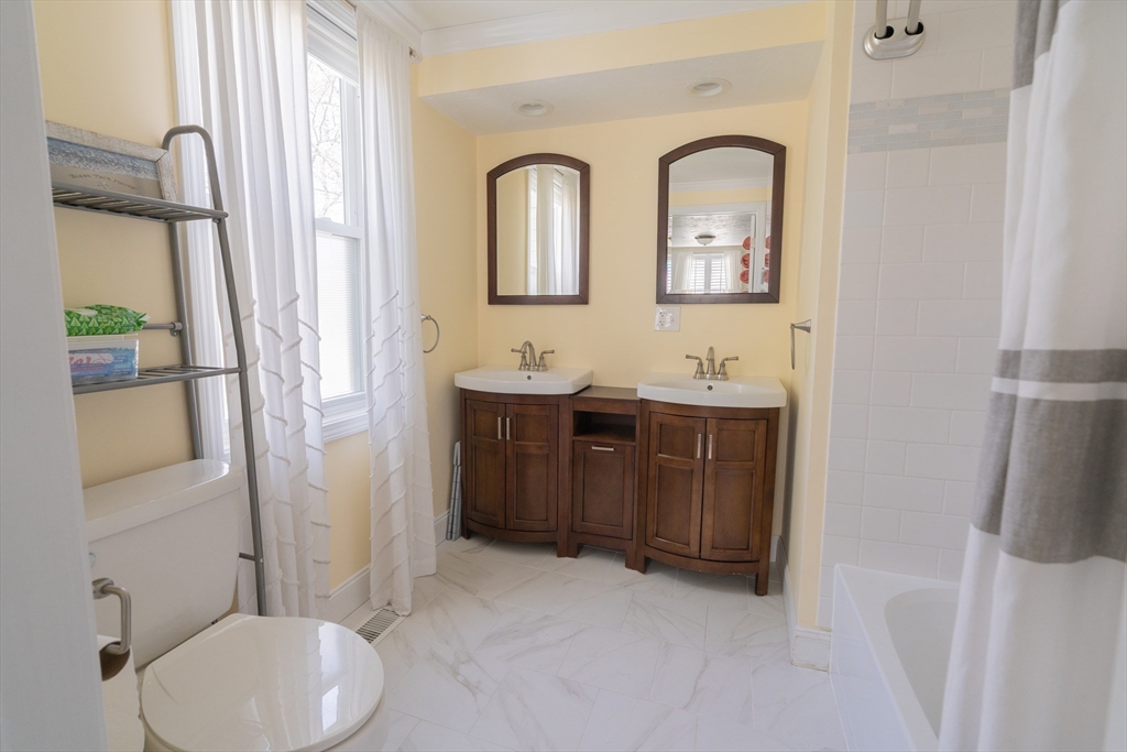 35 Neponset Street Canton, MA 02021 - Photo 14 of 29 a bathroom with a toilet sink and mirror